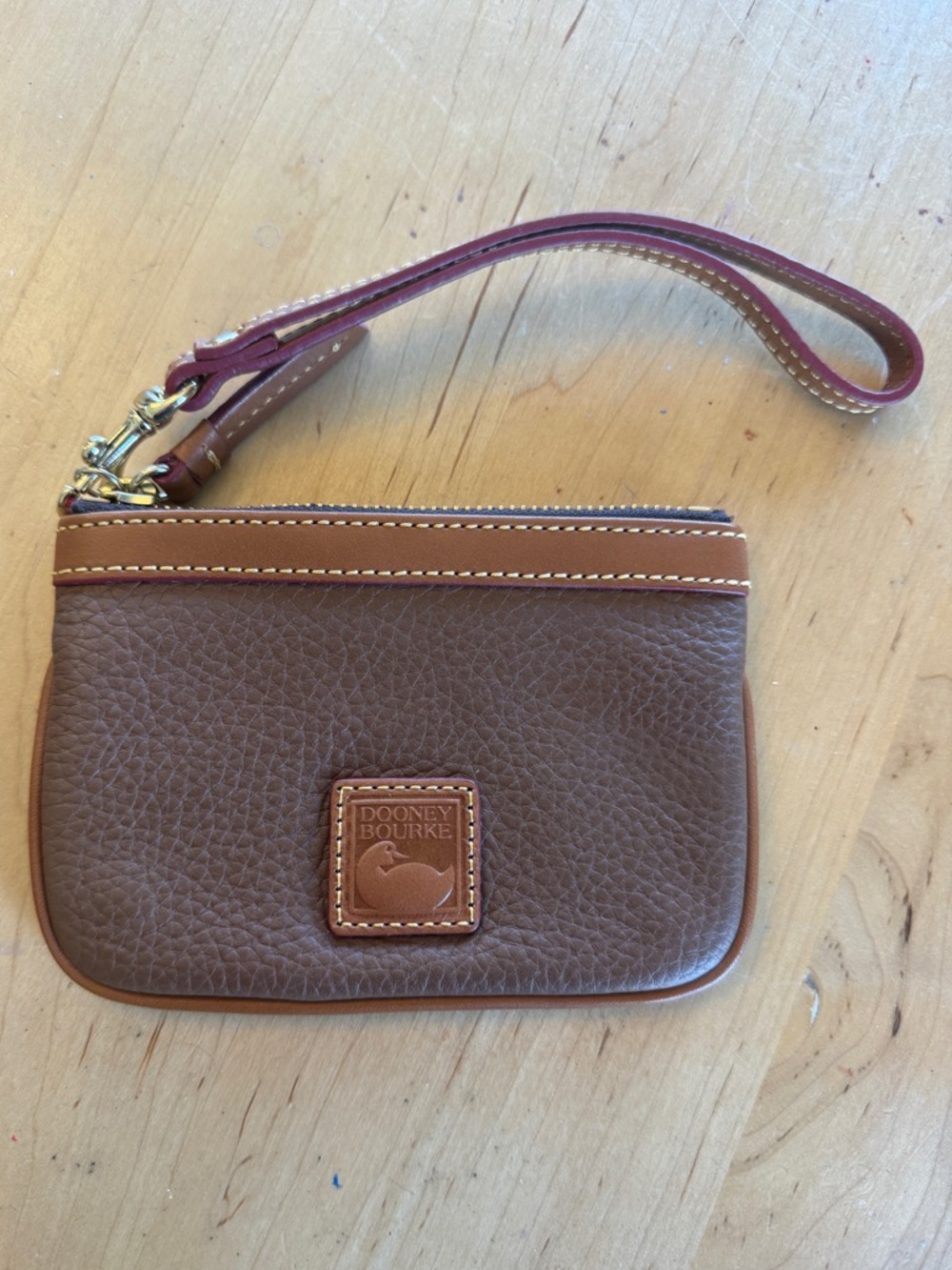 Dooney & Bourke Brown and Tan Leather Wristlet with Burgundy Strap - mini